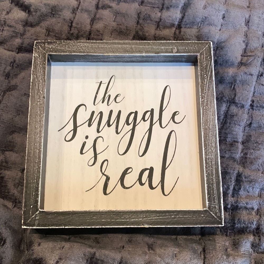 Sign that say “The snuggle is real”